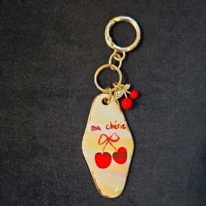 Gold and Red Keychain with Cherry Design
